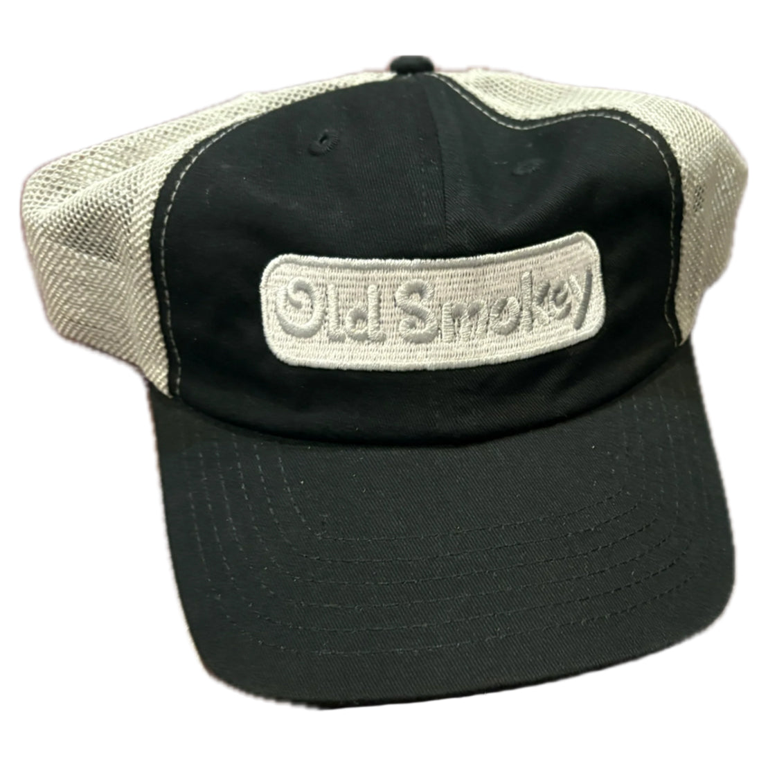 Black and beige cap with 'Old Smokey' logo on a white background