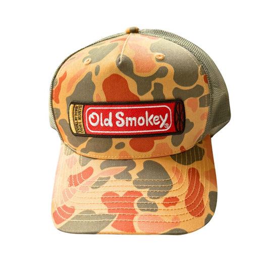 Camouflage-patterned cap with Old Smokey logo that looks like a red shotgun shell